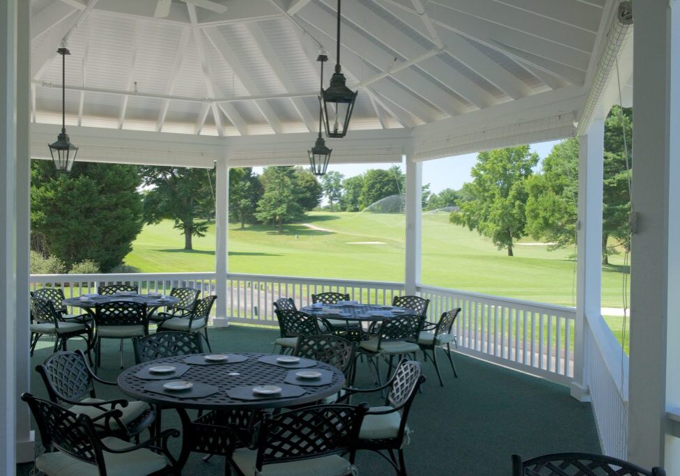 The corner porch of the Elkridge Country Club in Baltimore, Maryland renovated by Delbert Adams Construction Group, Commercial Construction division.